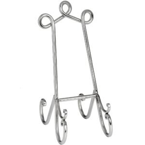 This is the Small Nickel Easel. Elevate the look of any plaque or picture frame with this table top silver easel. Its eye-catching scroll top subtley draws the eye to its contents