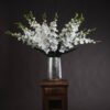 Our exquisite faux white gladioli offer a timeless classic that brings elegance to any space. These lifelike Gladiolus grandiflorus stems feature pristine white florets arranged along tall