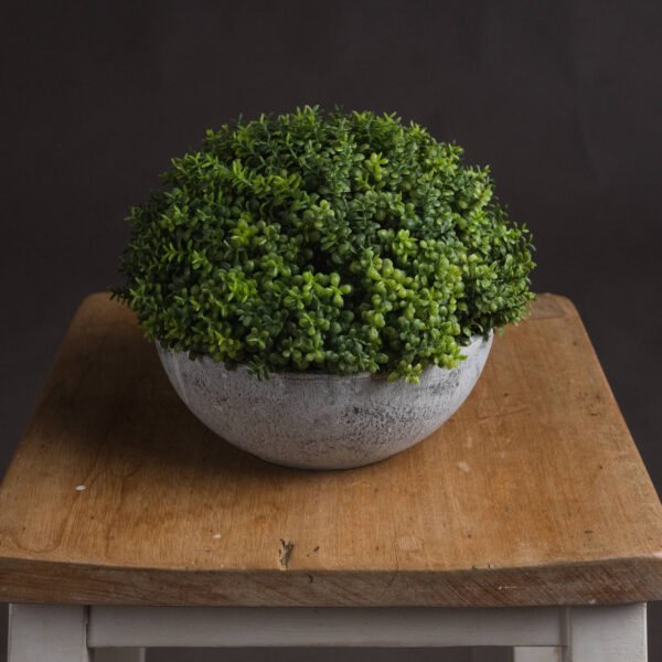 A meticulously detailed artificial plant that brings life to any interior space without the need for maintenance. Each leaf has been carefully arranged to create a perfect spherical shape