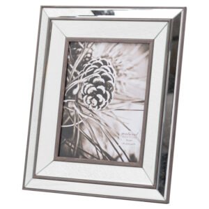 This is the Tristan Mirror And Wood 8 x 10 Frame. A wonderful example of the powerful effect of contrasting man-made and natural materials to highlight the beautiful properties of each. Perfect for adding an element of luxury to any interior. This frame's use of bevelled mirror gives it an eye-catching