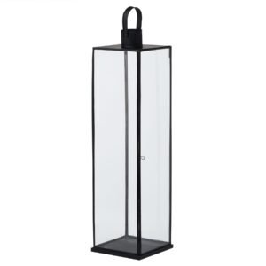 This is the Flat Top Large Black Lantern. This stylish black metal lantern is a contemporary style statement that will add not ambience and interest to a space. Additional sizes available in the same style for impactful staggered height displays. Finish the look with one of our realistic LED wax candles.