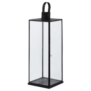 This is the Flat Top Medium Black Lantern. This stylish black metal lantern is a contemporary style statement that will add not ambience and interest to a space. Additional sizes available in the same style for impactful staggered height displays. Finish the look with one of our realistic LED wax candles.