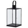 This is the Flat Top Small Black Lantern. This stylish black metal lantern is a contemporary style statement that will add not ambience and interest to a space. Additional sizes available in the same style for impactful staggered height displays. Finish the look with one of our realistic LED wax candles.