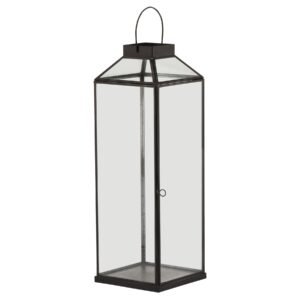 This is the Glass Top Large Black Lantern. This stylish black metal lantern is a contemporary style statement that will add not ambience and interest to a space. Additional sizes available in the same style for impactful staggered height displays. Finish the look with one of our realistic LED wax candles.