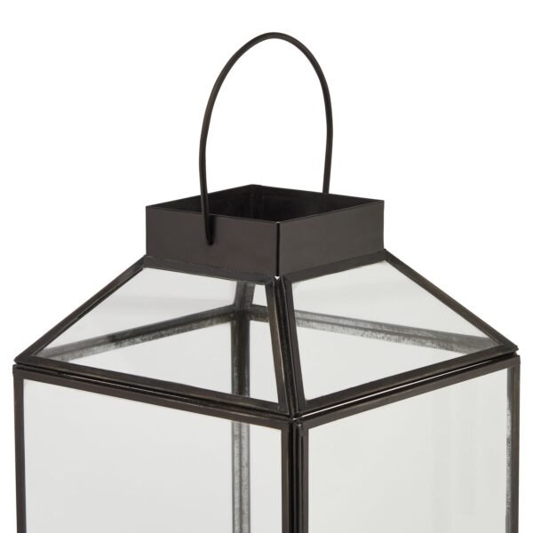 featuring clean geometric lines and a sleek glass top that creates a stunning interplay of light and shadow. The contemporary silhouette brings architectural interest to any space while providing the perfect showcase for LED wax candles