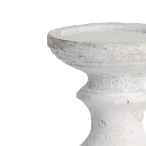 the Small Stone Candle Holder is finished in a stone effect and features subtle textures. Dress the centre of a tablescape with the collection of Stone Candle Holders