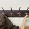 Wooden Base With 4 Brass Coat Hooks