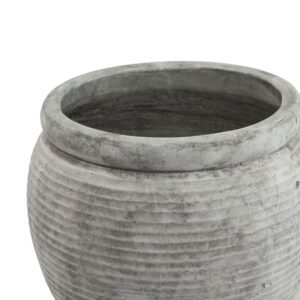 this plant pot features a distinctive rimmed profile that adds architectural interest to any retail space. The subtle texture and weathered finish evoke images of sun-drenched courtyards and ancient vessels